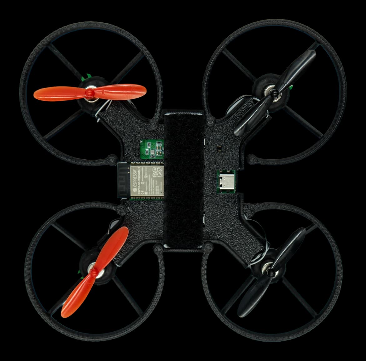 RobonHub drone from above — ESP32-S3 board visible